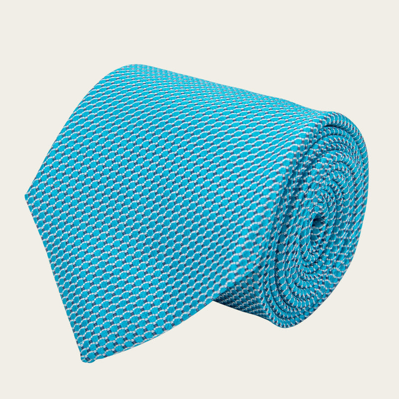Tirkizno plava kravata sa geometrijskim oblicima