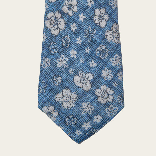 Plava kravata sa belim cvetovima